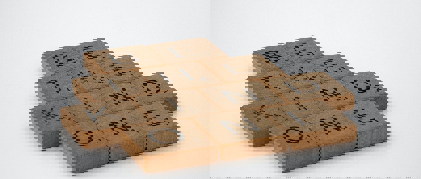 Photograph of wooden tiles spelling out 'Be the kind one'