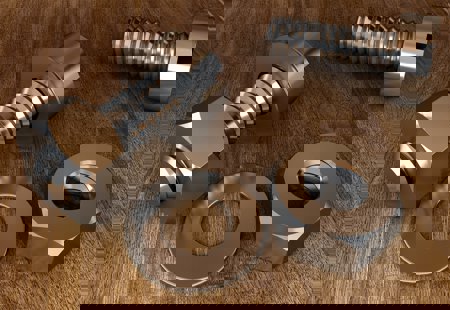 Close-up photograph of metal nuts and bolts