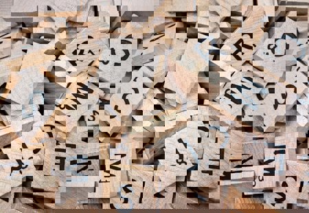 A pile of mixed scrabble tiles