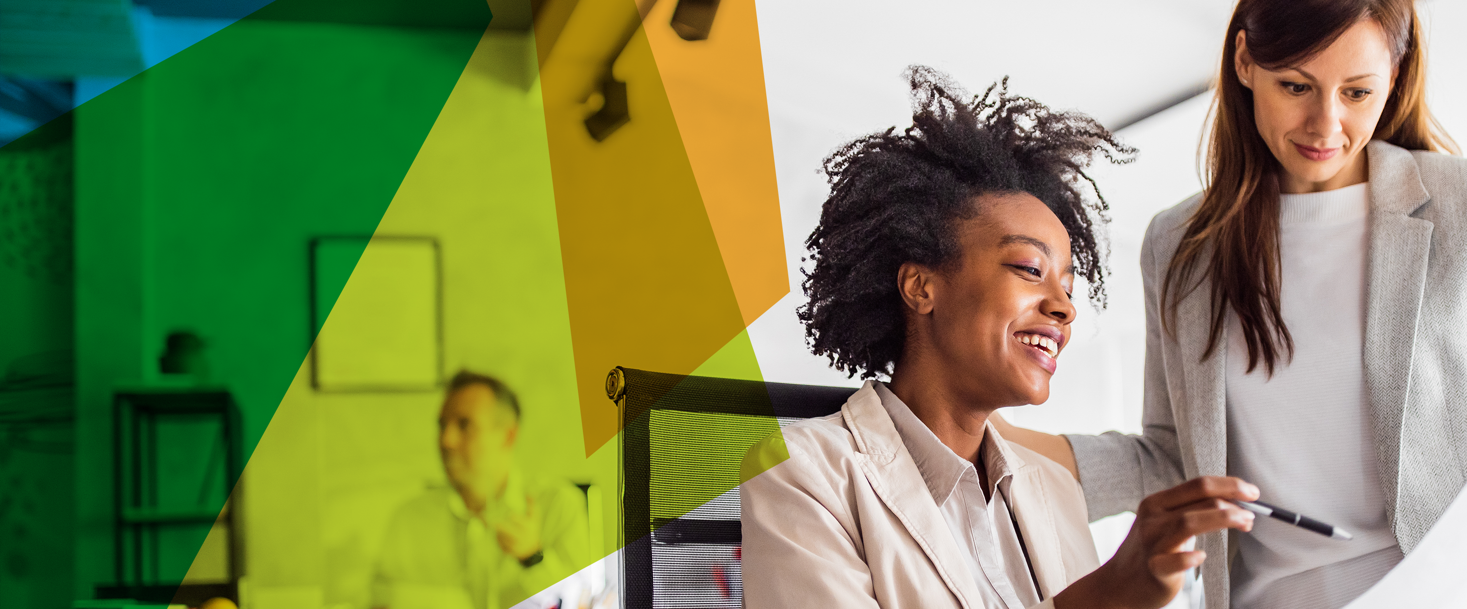 Photograph of two women in a modern working environment 