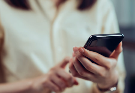Closeup Young Woman Hand Holding Smartphone Chatting With Friends Social Network