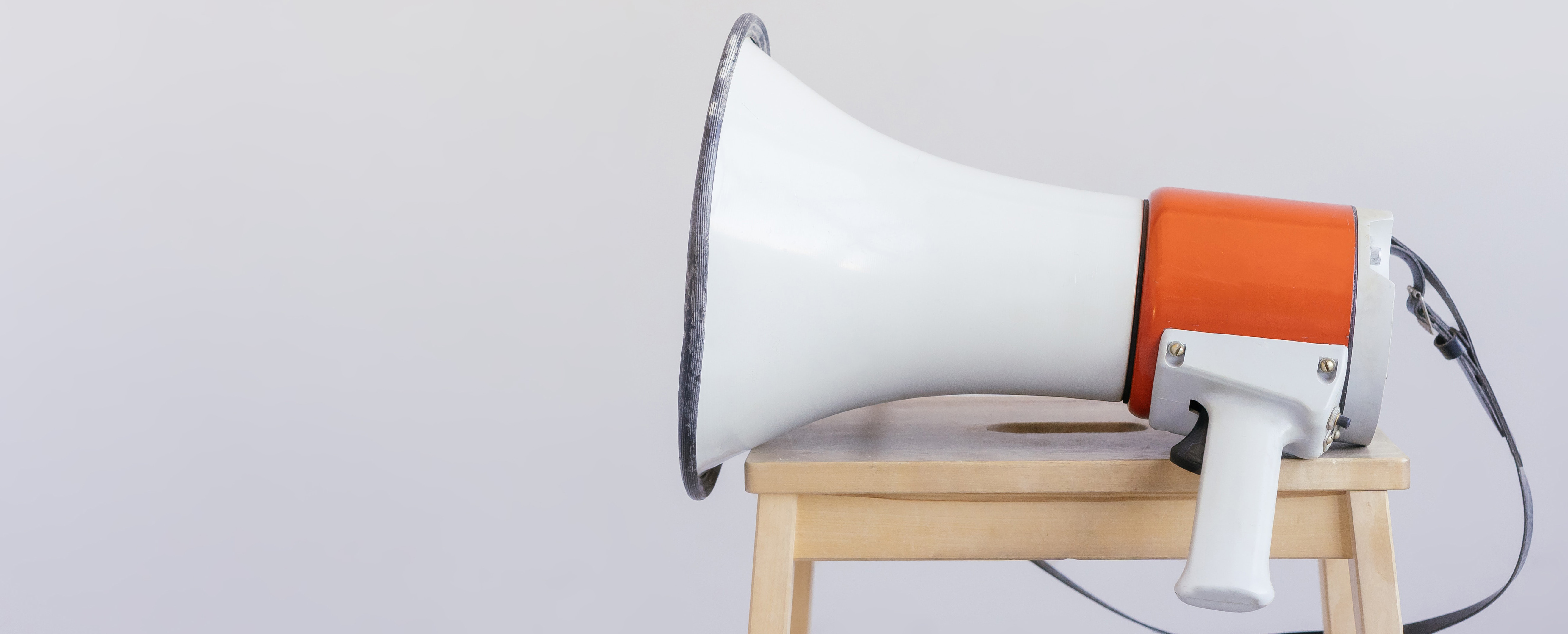Photograph of a megaphone sitting on a stool