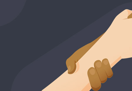 Two arms holding hands on a dark background