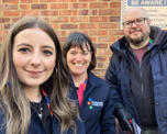 Photo of three Futures people getting ready to go out and clean up the community areas