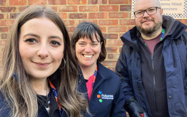 Photo of three Futures people getting ready to go out and clean up the community areas