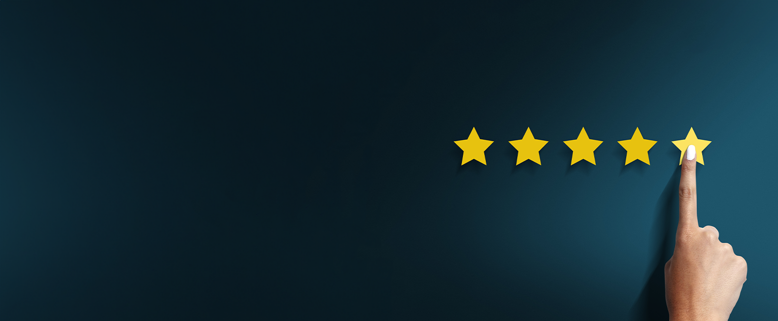 Five yellow stars on a dark blue background with a finger on the fifth star